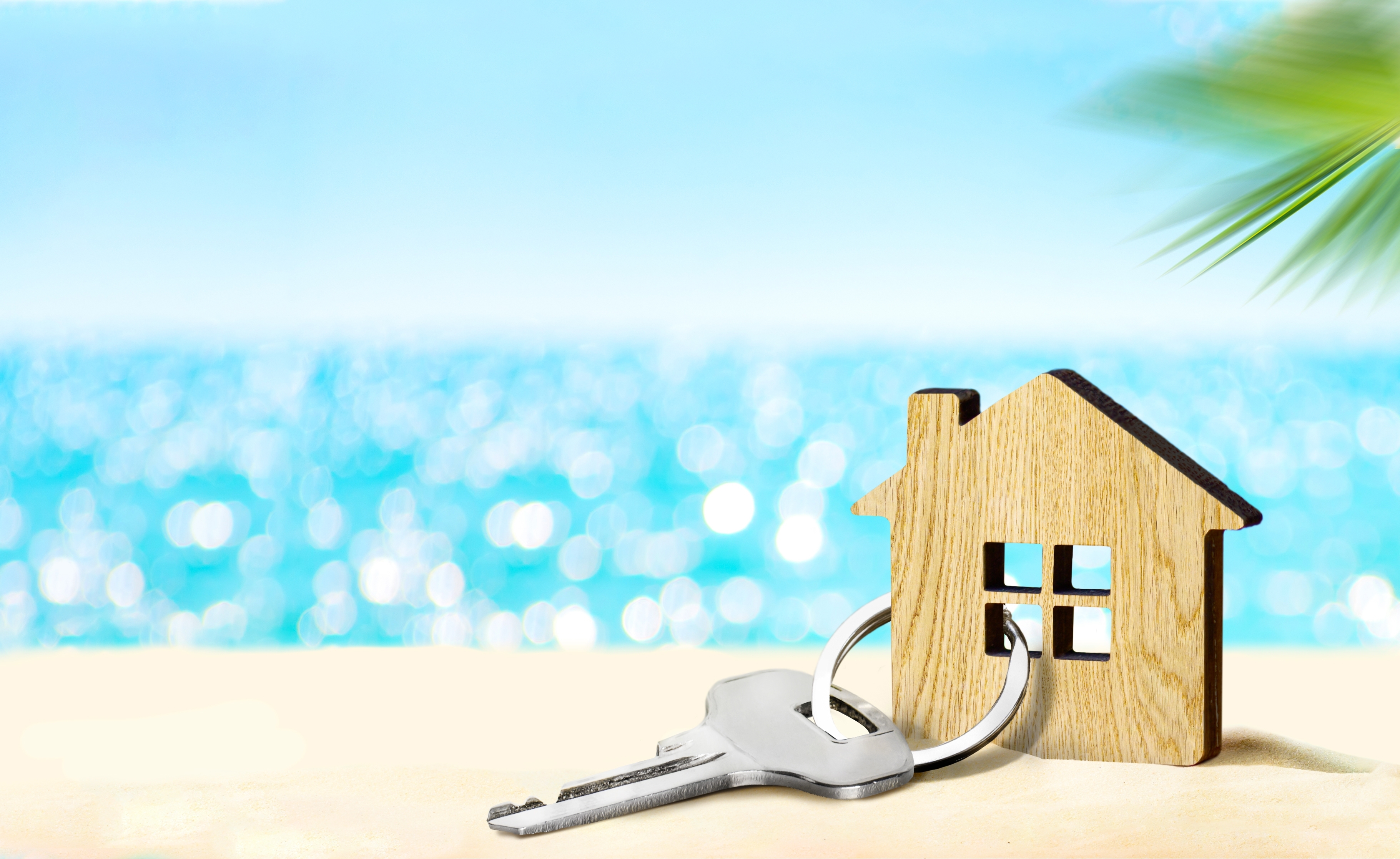 A set of house keys handed over — the moment of trust between owner and agency